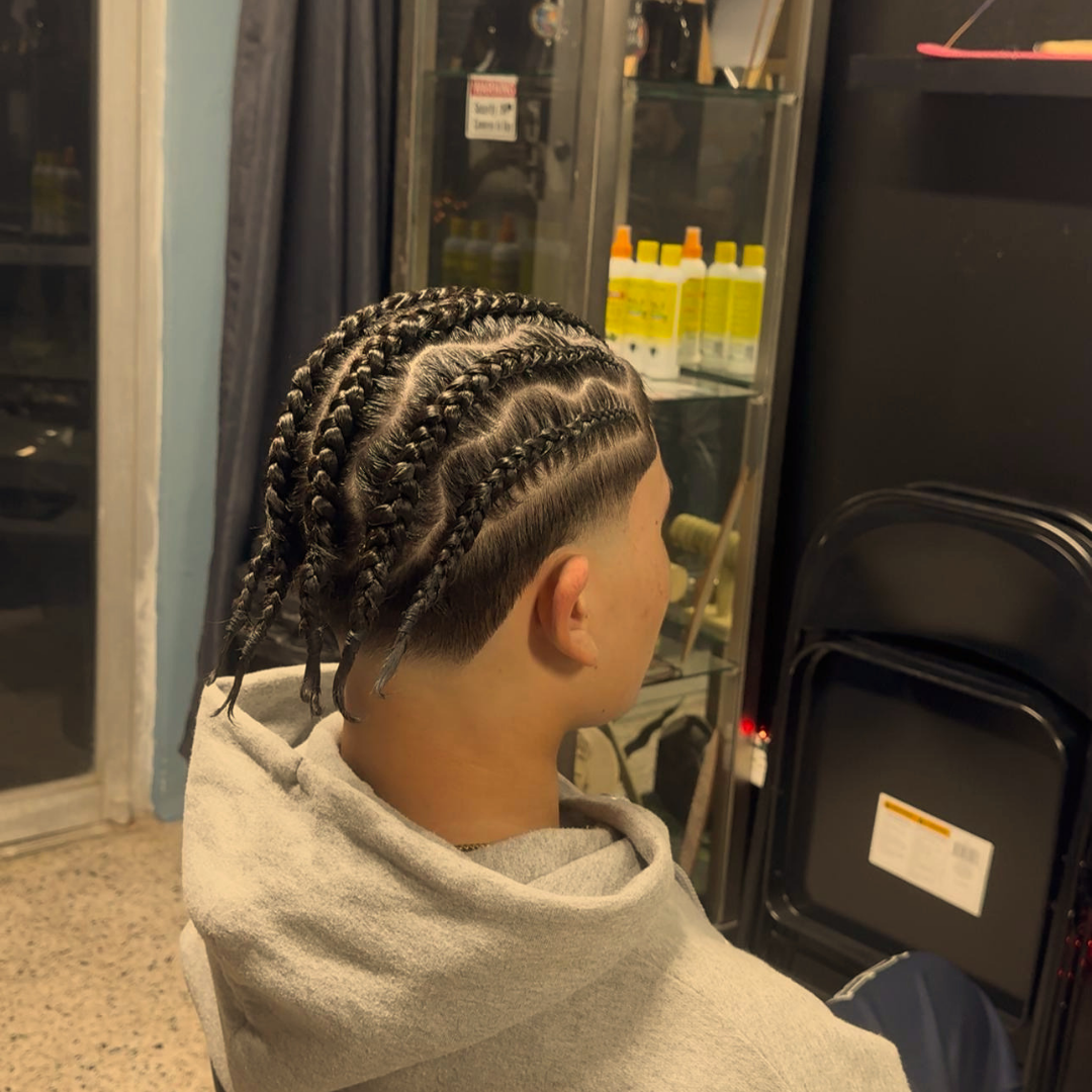 Cornrows braiding close-up